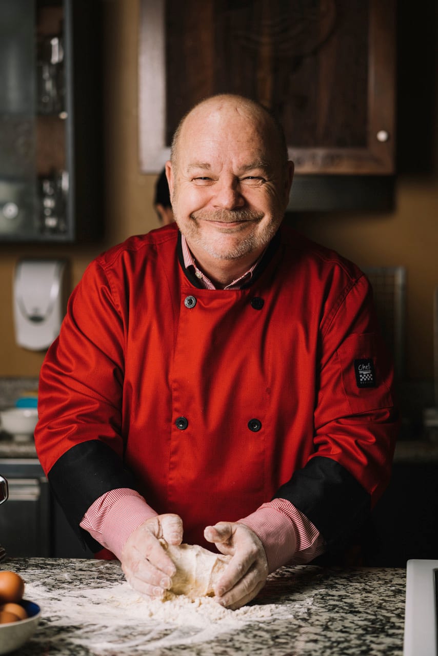 Bryan Lavery working dough at the counter